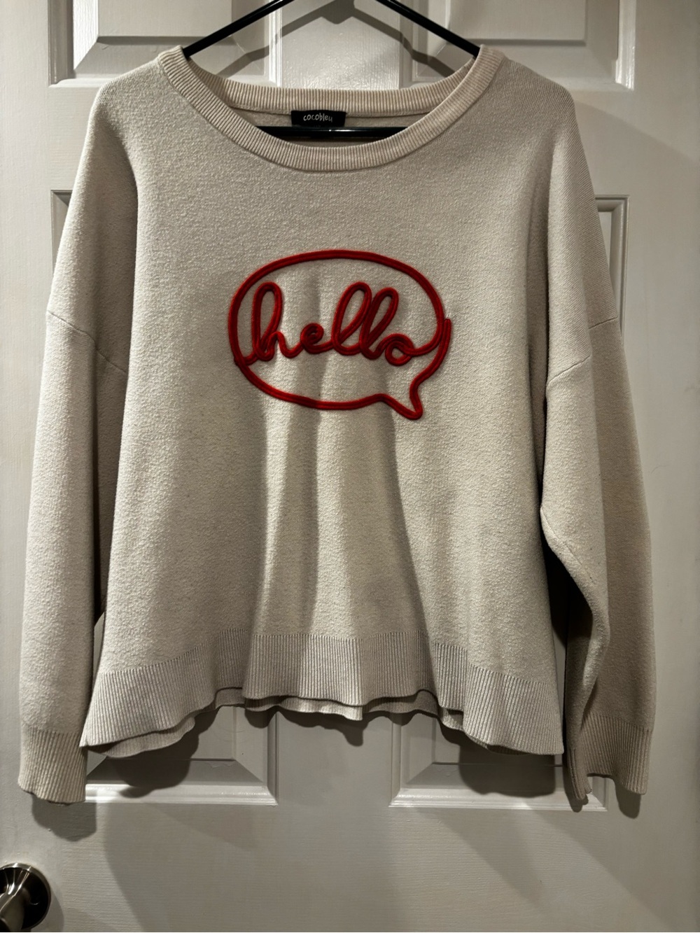 Cream Pullover Sweater with Orange "Hello" Appliqué